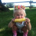 Sparkes girl eating corn image